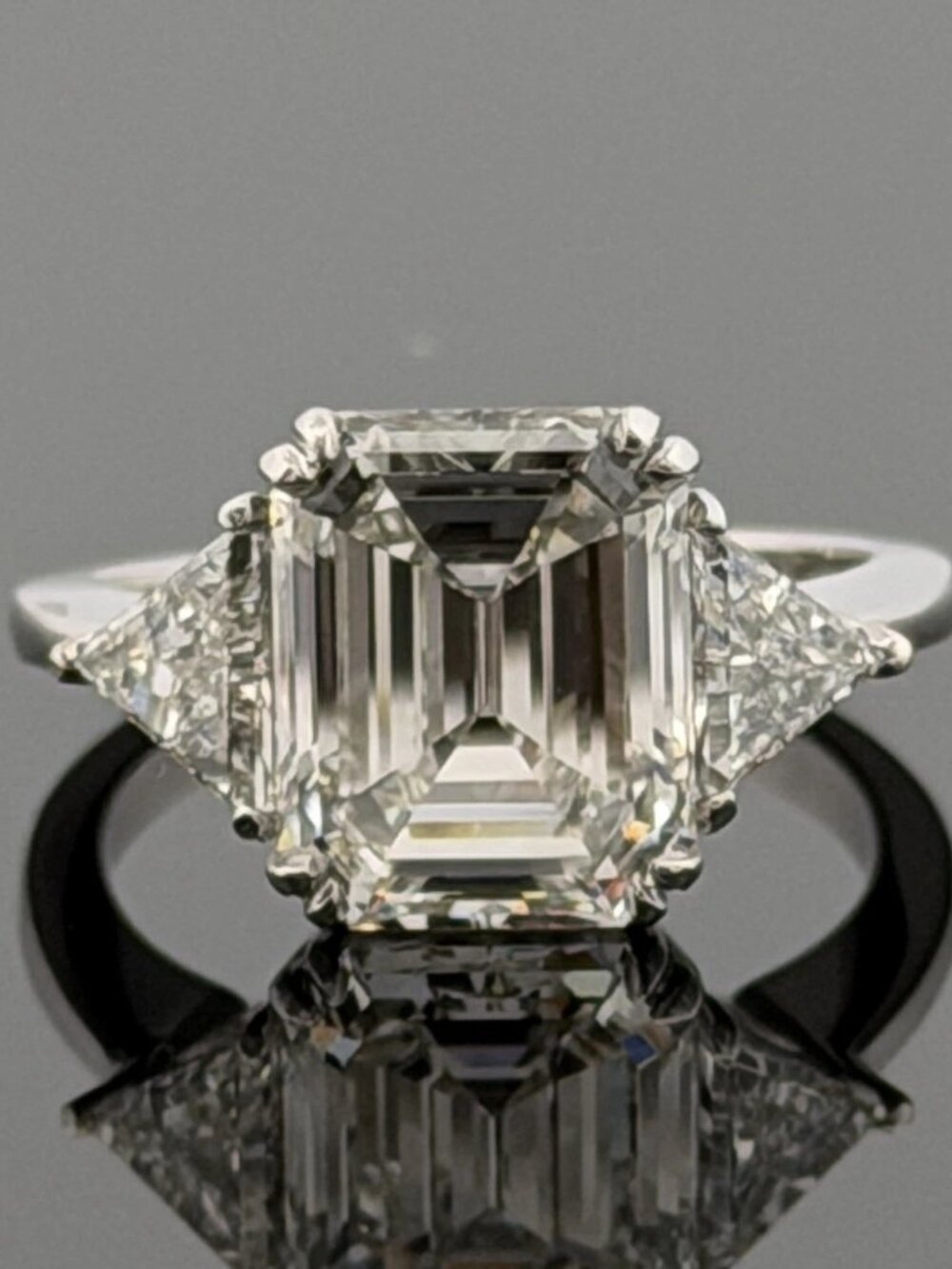 Platinum Three-Stone Ring 4.10ct Emerald Cut Natural Diamond GIA with Trillions